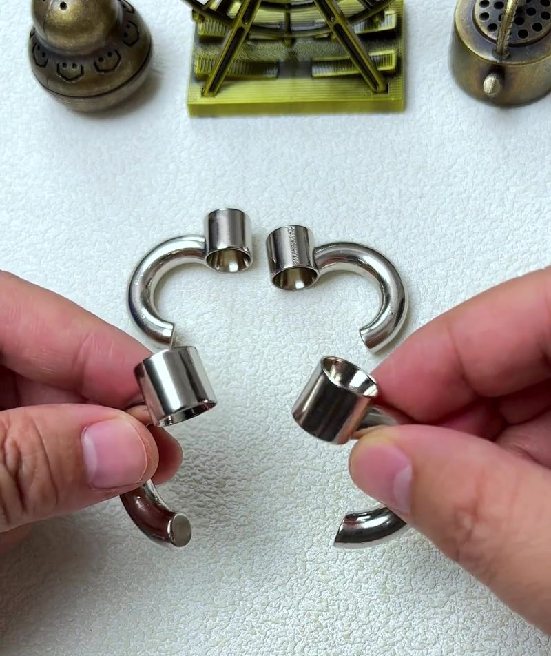 Cast Galaxy Puzzle: The 4-Piece Metal Brain Teaser That Breaks Your Assumptions 16 step 02 individual piece closeup